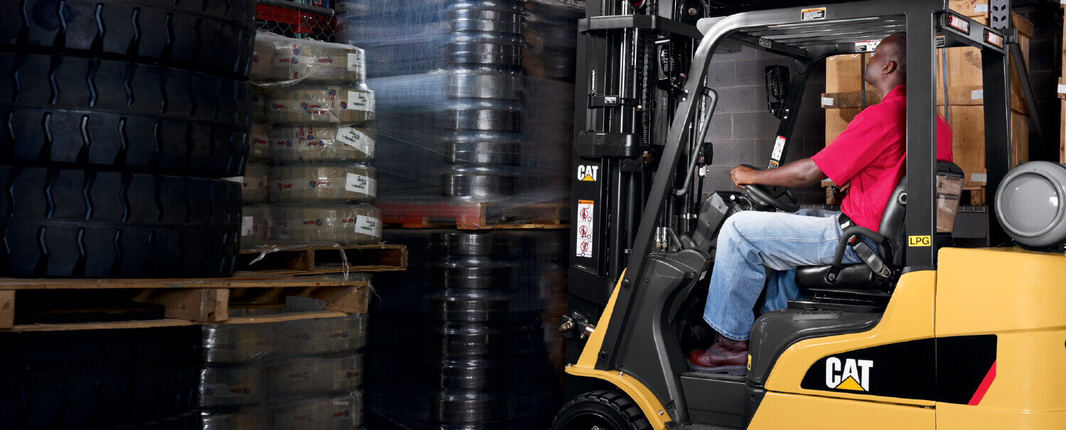 Man driving Cat IC cushion tire forklift